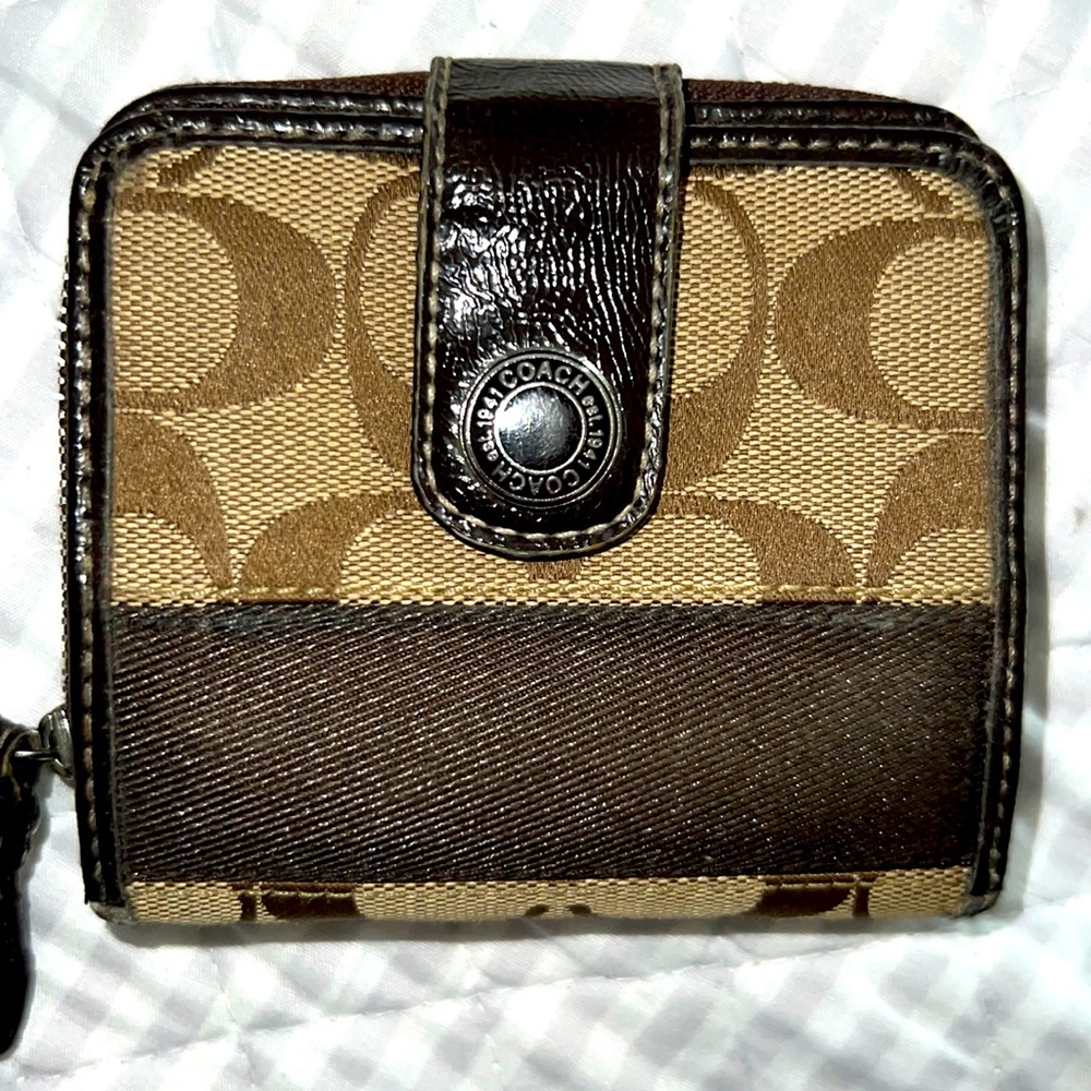 Coach mini signature wallet. Has a bifold and zippered coin holder.